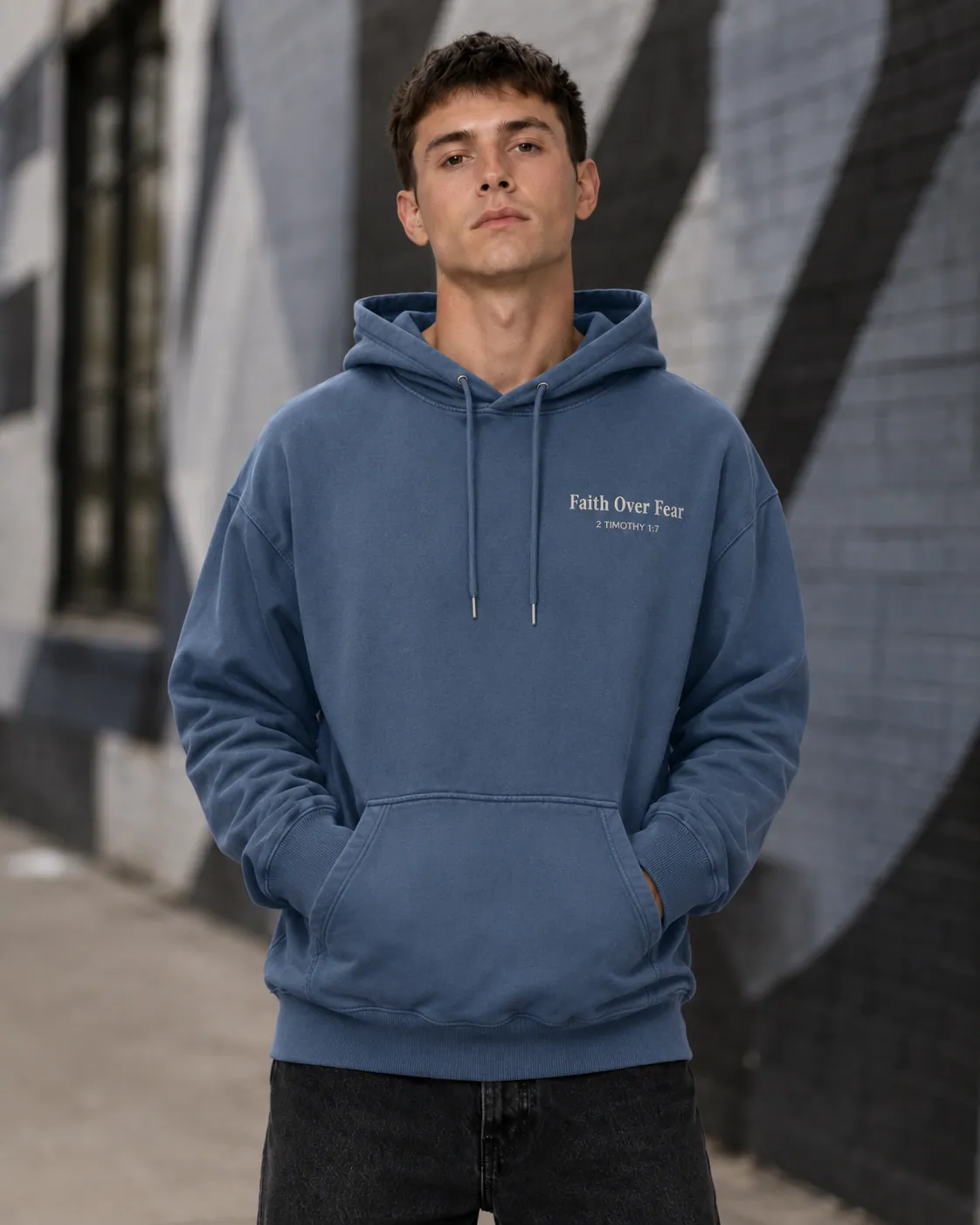Model wearing the Faith Over Fear hoodie